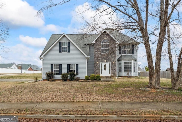 front facade featuring a front lawn