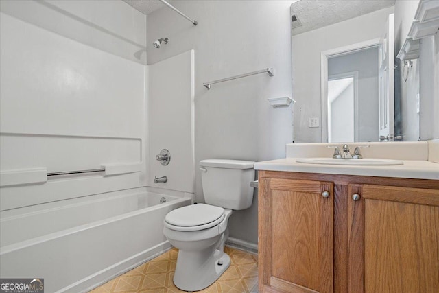 full bathroom featuring vanity, toilet, shower / bath combination, and a textured ceiling