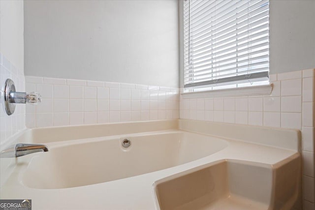 bathroom with a washtub