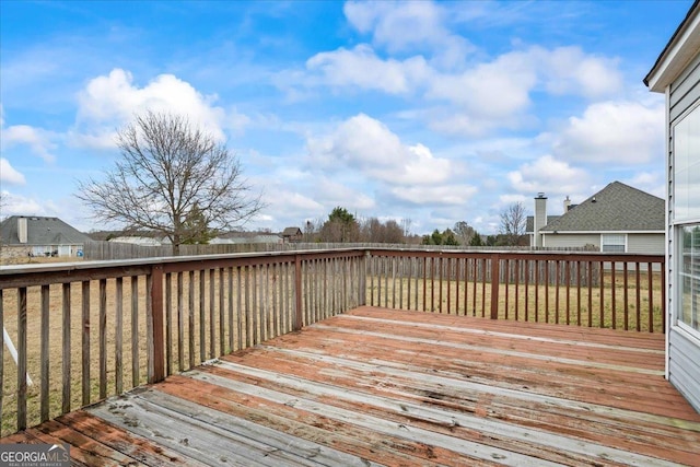 wooden terrace with a yard