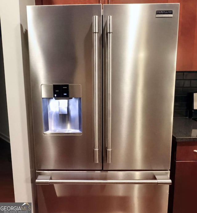 400 W Peachtree St NW Unit 3216, Atlanta, GA 30308 - interior details with dark countertops, high end refrigerator, and decorative backsplash