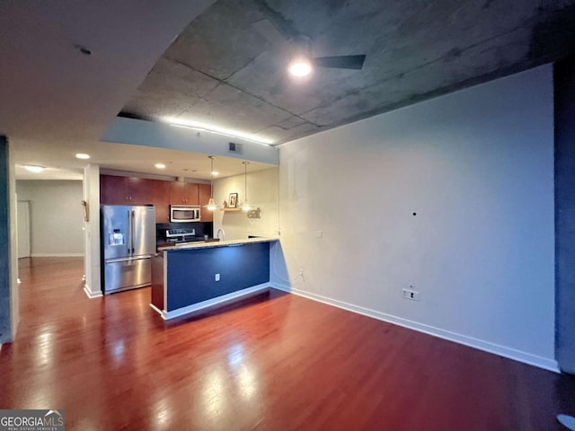 400 W Peachtree St NW Unit 3216, Atlanta, GA 30308 - kitchen featuring appliances with stainless steel finishes, dark wood finished floors, a peninsula, and baseboards
