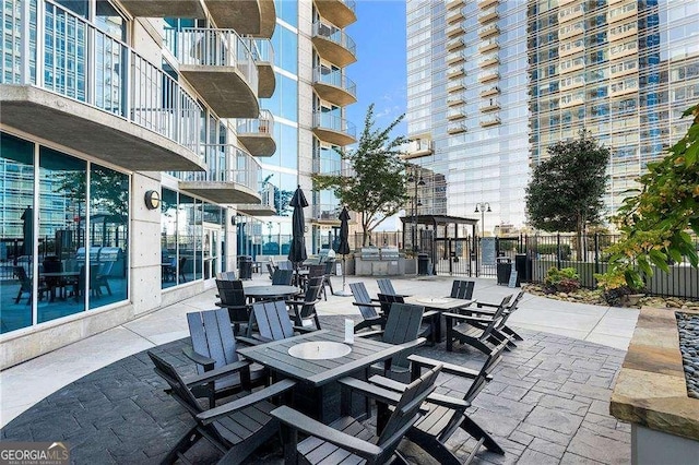 400 W Peachtree St NW Unit 3216, Atlanta, GA 30308 - view of patio featuring outdoor dining area and fence