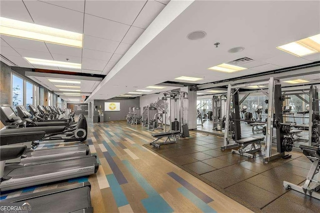 400 W Peachtree St NW Unit 3216, Atlanta, GA 30308 - workout area with a paneled ceiling, plenty of natural light, and visible vents