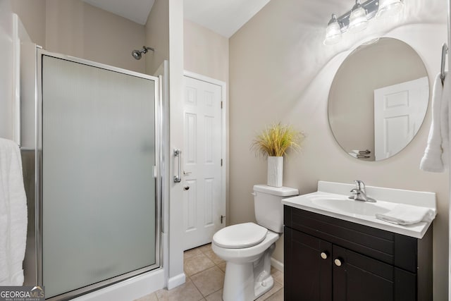 bathroom with tile patterned flooring, an enclosed shower, vanity, and toilet