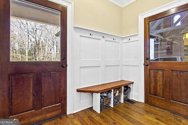 mudroom with crown molding and hardwood / wood-style floors