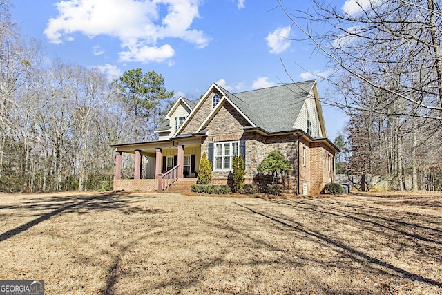 view of front of home featuring a porch and a front lawn