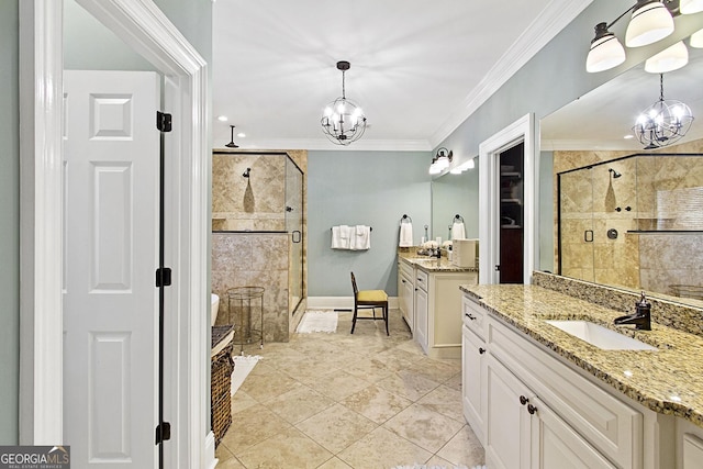 bathroom featuring crown molding, vanity, a chandelier, and a shower with shower door