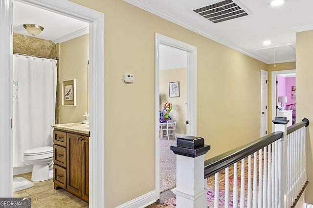 corridor featuring ornamental molding and light hardwood / wood-style floors