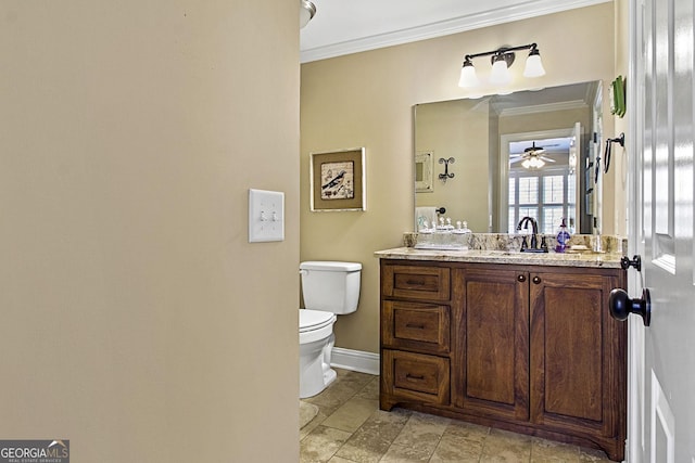 bathroom featuring vanity, ceiling fan, crown molding, and toilet