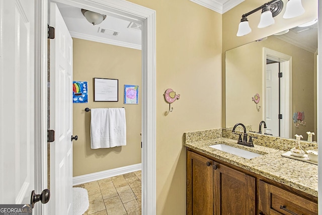 bathroom with ornamental molding and vanity