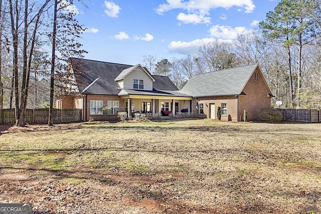 front facade featuring a front lawn and a porch