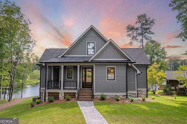 view of front of house with central AC and a lawn