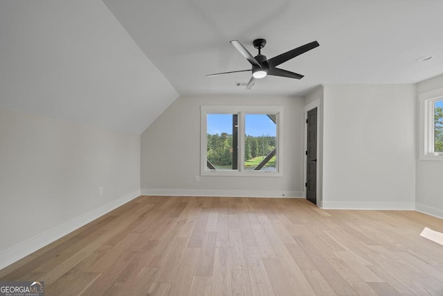 additional living space featuring ceiling fan, lofted ceiling, and light hardwood / wood-style floors