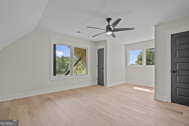 bonus room with vaulted ceiling, light hardwood / wood-style floors, and ceiling fan