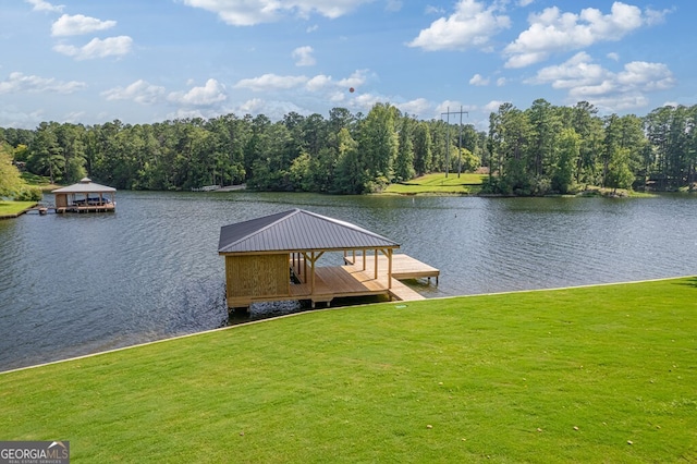 view of dock with a water view, a gazebo, and a lawn