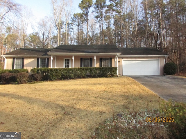 ranch-style home with a garage and a front yard