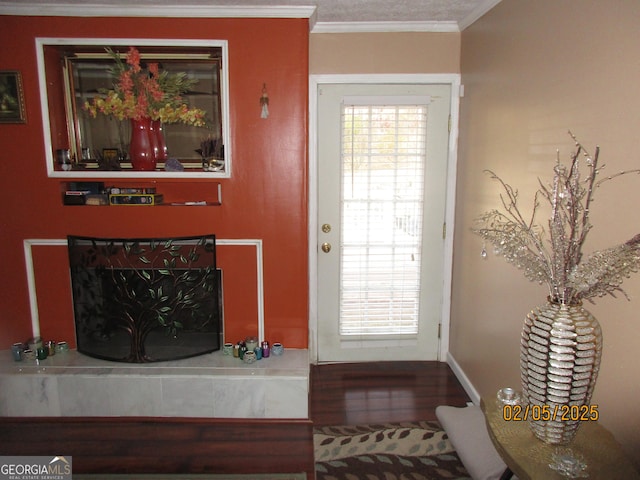 doorway to outside featuring hardwood / wood-style flooring and ornamental molding