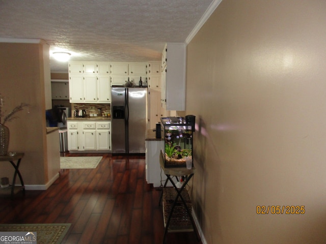 kitchen featuring dark hardwood / wood-style flooring, stainless steel fridge with ice dispenser, crown molding, and white cabinets