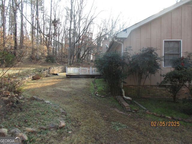 view of yard featuring a wooden deck