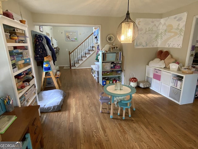 1400 Heidi Trl, Buckhead, GA 30625 - dining space with wood finished floors, stairway, and a chandelier