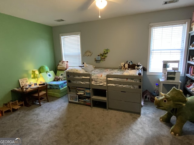 carpeted bedroom with ceiling fan