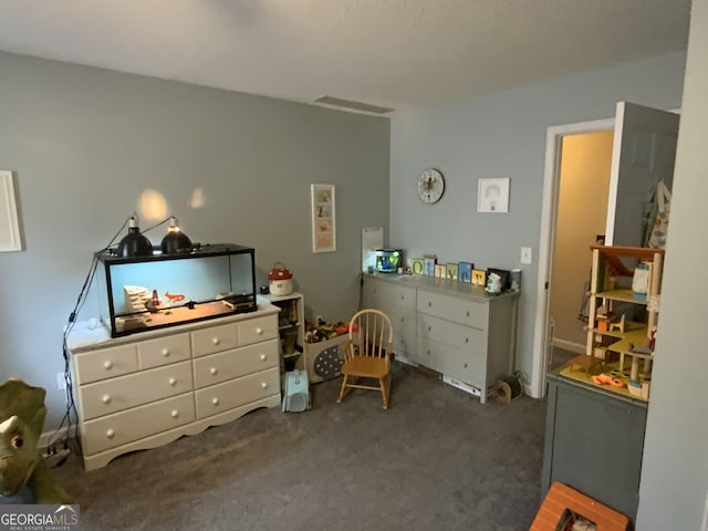 bedroom featuring dark colored carpet