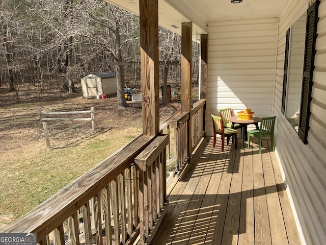 deck featuring a shed