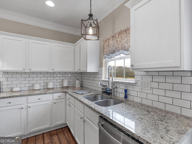 kitchen with white cabinetry, sink, and crown molding