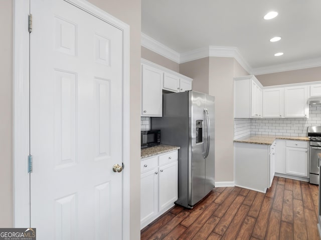 kitchen featuring stainless steel appliances, dark wood-type flooring, white cabinets, and light stone counters