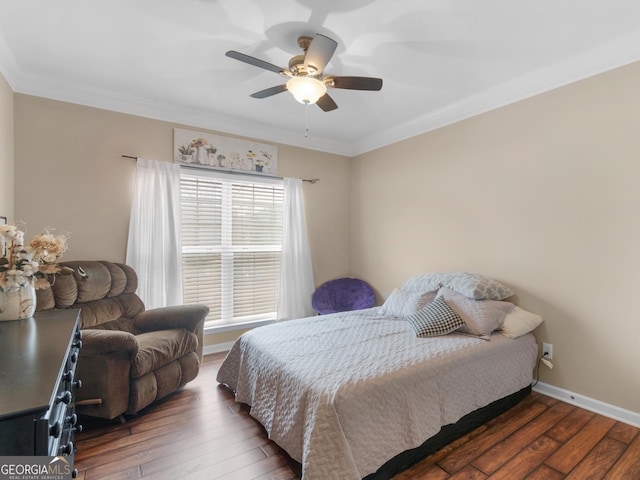 bedroom with crown molding, dark hardwood / wood-style floors, and ceiling fan