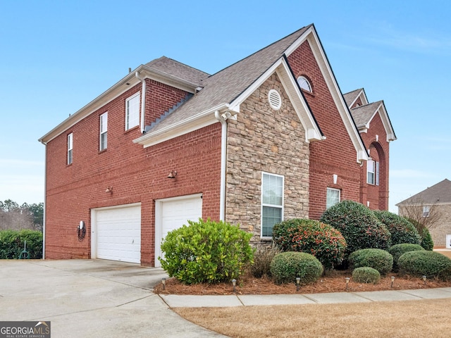 view of side of home featuring a garage