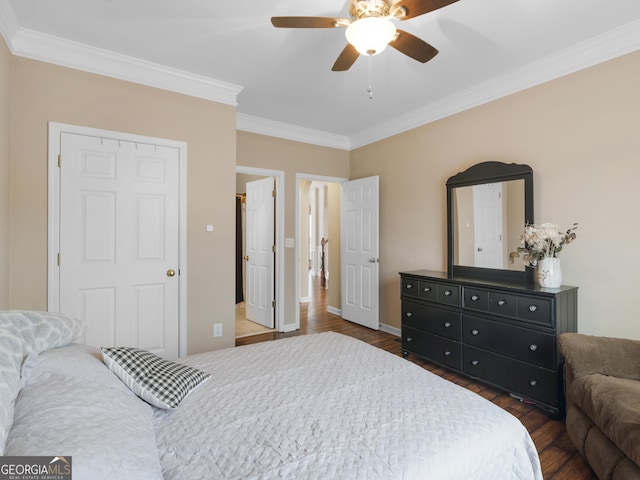 bedroom with ceiling fan, ornamental molding, and dark hardwood / wood-style flooring