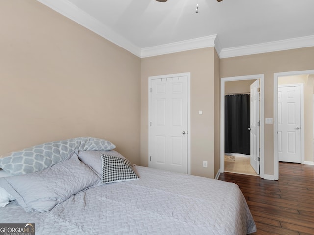 bedroom with ceiling fan, ornamental molding, and dark hardwood / wood-style flooring