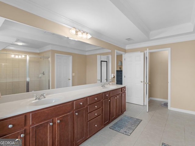 bathroom with a shower with shower door, vanity, ornamental molding, a tray ceiling, and tile patterned floors