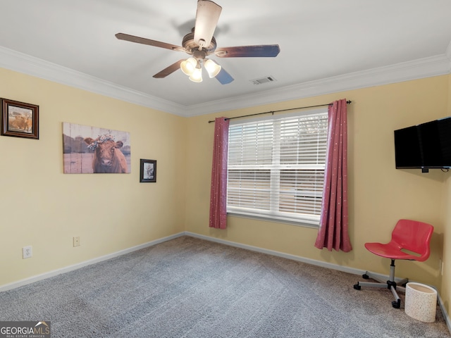 carpeted spare room with crown molding and ceiling fan