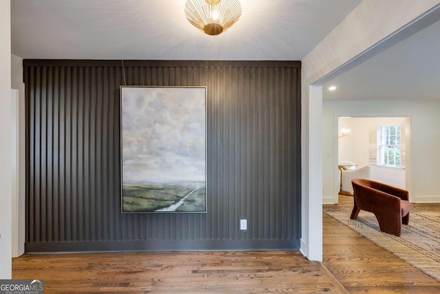 spare room featuring wood-type flooring