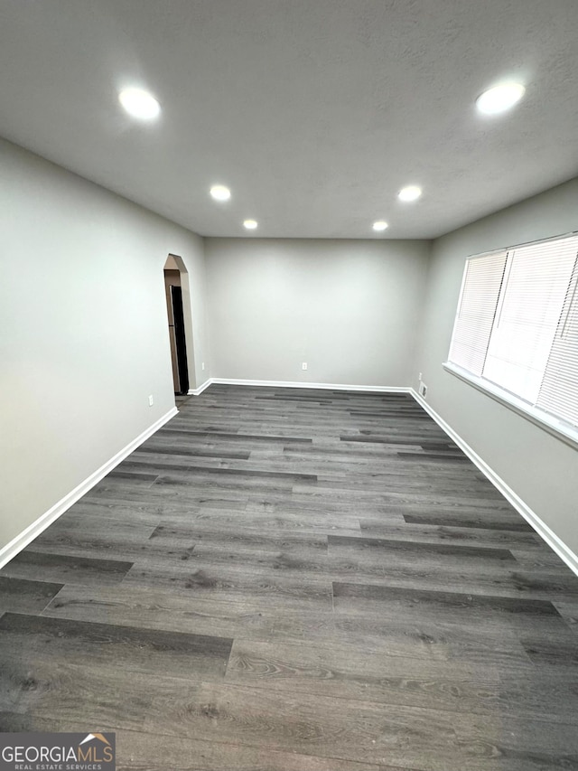 basement with dark wood-type flooring