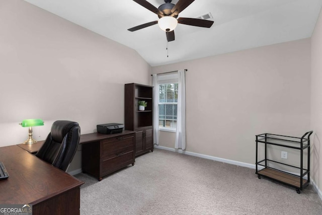 home office with ceiling fan, light colored carpet, and lofted ceiling