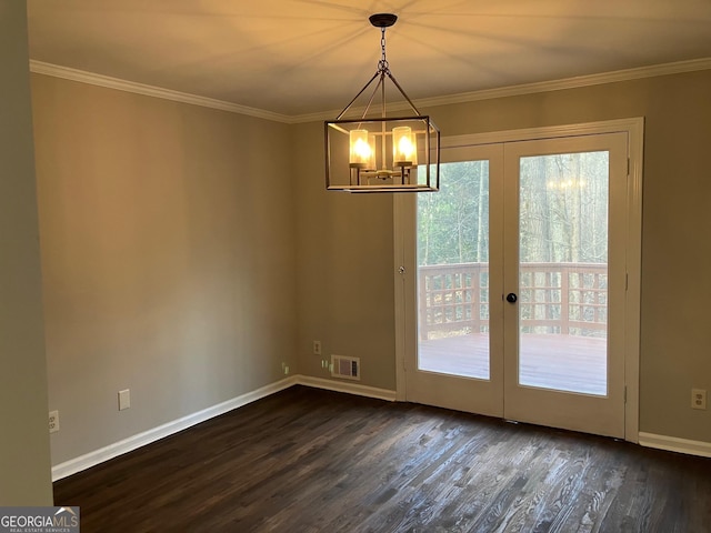 unfurnished dining area with an inviting chandelier, crown molding, a wealth of natural light, and dark hardwood / wood-style flooring