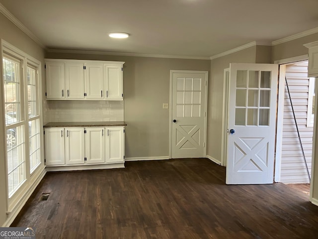 interior space featuring crown molding and dark hardwood / wood-style floors