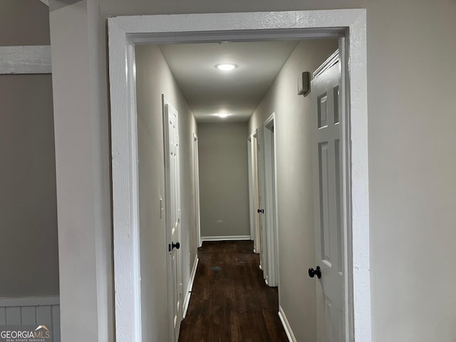 hall with dark wood-type flooring