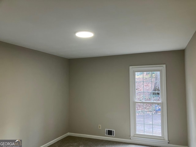 view of carpeted spare room