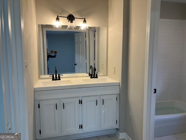 bathroom with vanity and a bathing tub