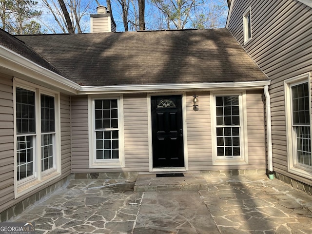 doorway to property with a patio area