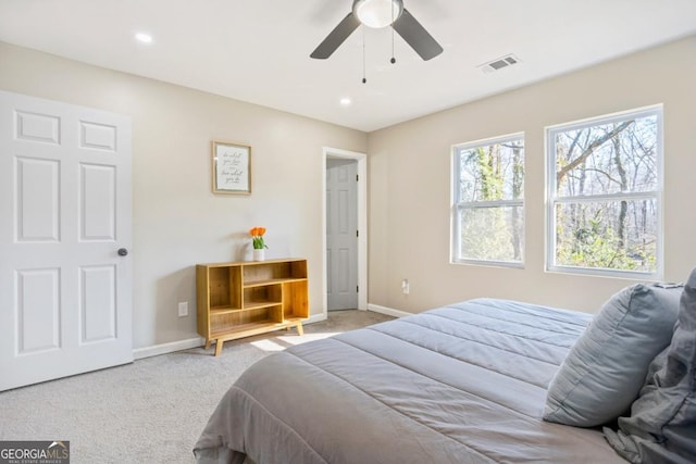 bedroom featuring ceiling fan and light carpet