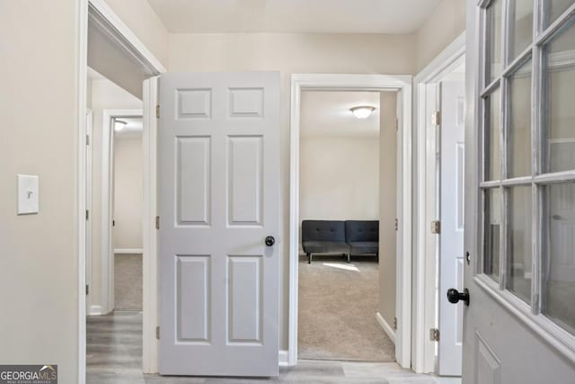 corridor featuring light wood-type flooring