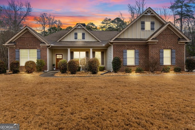 craftsman-style home with a yard