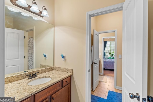 bathroom with vanity and tile patterned flooring