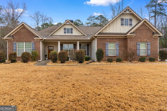 craftsman-style house with a front lawn